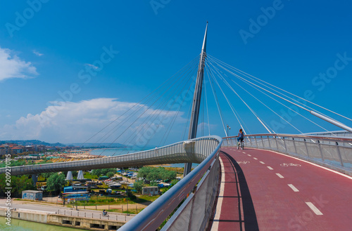 Pescara, Italy - 31 May 2018 - The Ponte del Mare monumental bridge and the Ferris wheel on the beach, in the canal and port of Pescara city, Abruzzo region