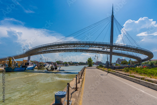 Fototapeta Naklejka Na Ścianę i Meble -  Pescara, Italy - 31 May 2018 - The Ponte del Mare monumental bridge and the Ferris wheel on the beach, in the canal and port of Pescara city, Abruzzo region