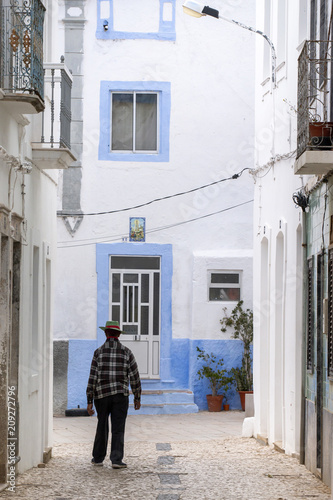 lonely man walking in the streets © Mauro Rodrigues