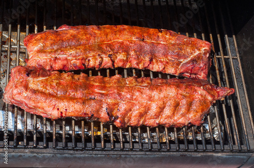 Rack of ribs cooking on the grill