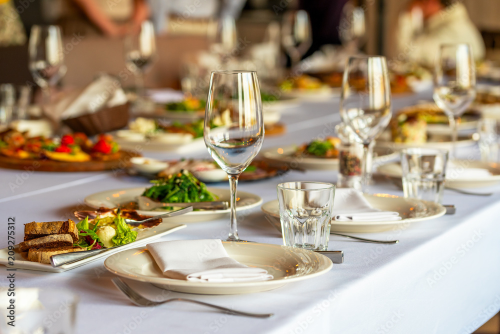 glasses for wine and a beautifully decorated table with snacks in the restaurant glasses for wine and a beautifully decorated table with snacks in the restaurant