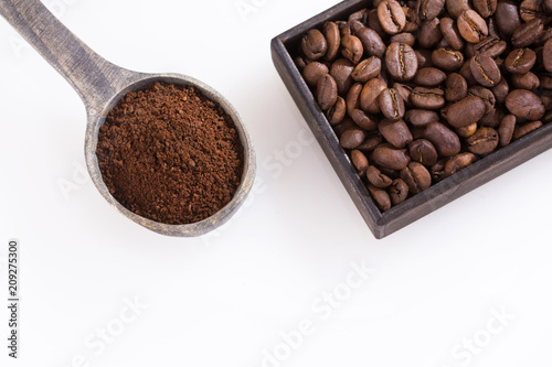 Coffee beans and ground powder. White background - Top view