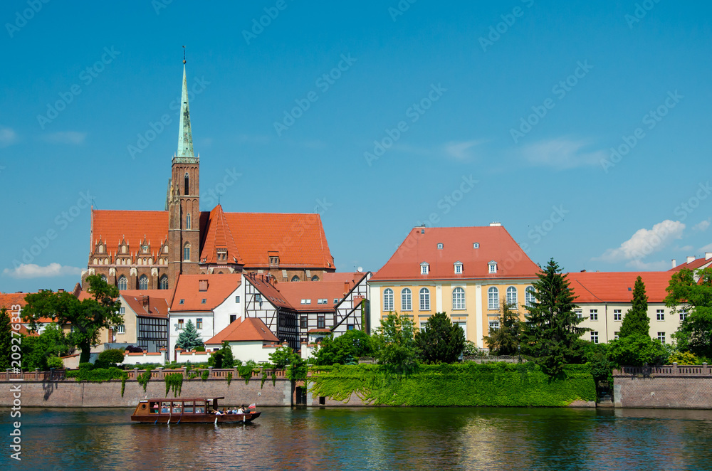 Wroclaw, Poland. View with river Oder and Church on the other side of the river. Island Tumski, old town.
