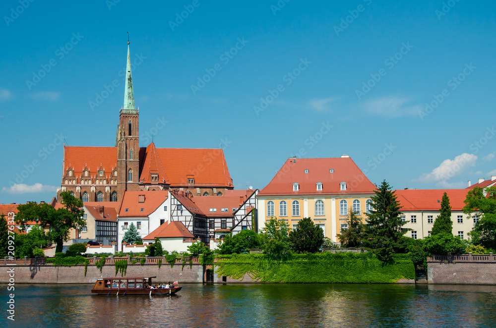 Wroclaw, Poland. View with river Oder and Church on the other side of the river. Island Tumski, old town. Wroclaw, Poland. View with river Oder and Church on the other side of the river. Island Tumski, old town.