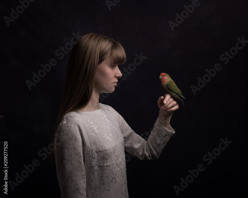 Girl with lovebird photo