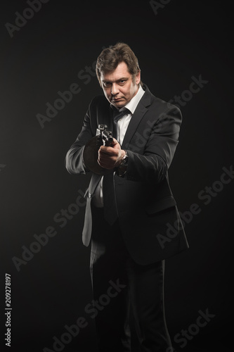 Handsome middle aged man gangster with Thompson machine gun photo