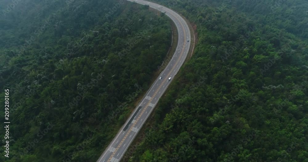 Aerial view country road in forest Aerial view country road in forest