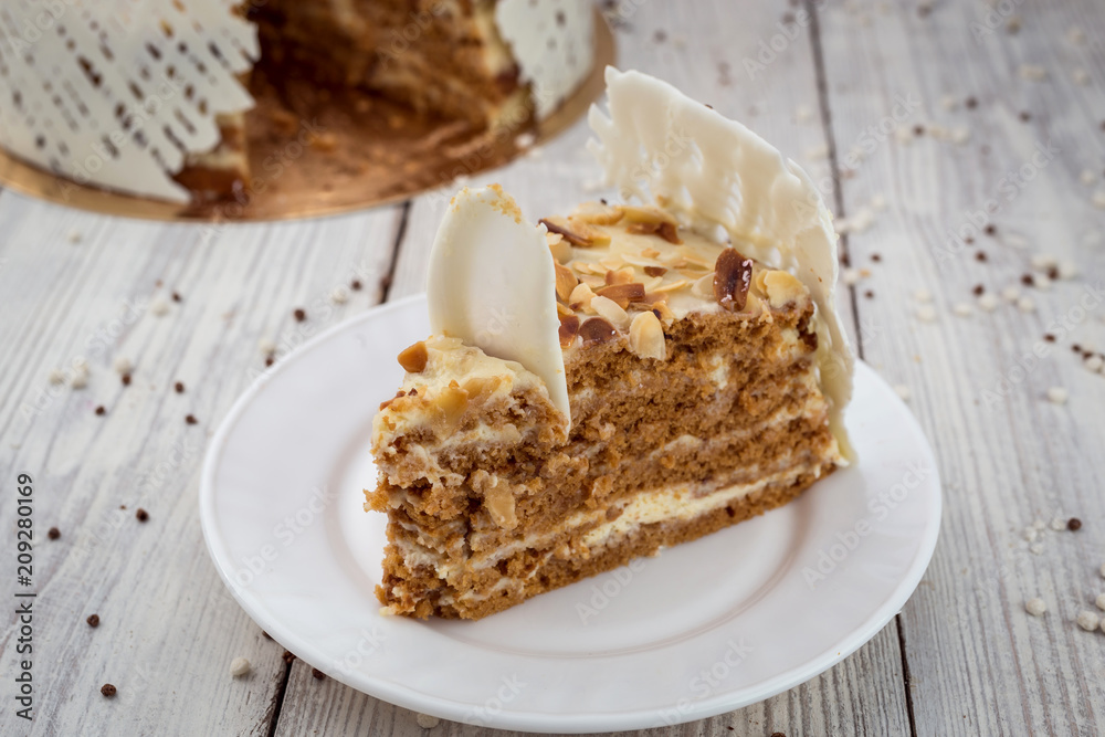 White Chocolate vegane cake with nuts and cream. Birthday concept White Chocolate vegane cake with nuts and cream. Birthday concept