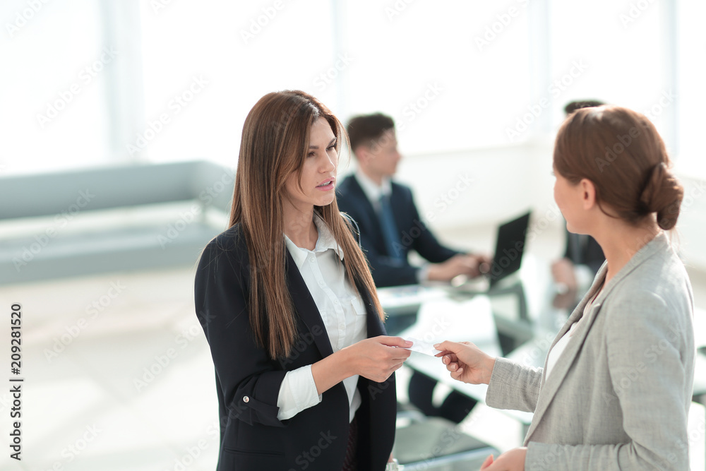 successful business woman gives her business card successful business woman gives her business card