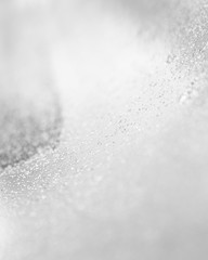 Abstract of Bright and sparkling bokeh background. silver and diamond dust bokeh blurred lighting from glitter texture