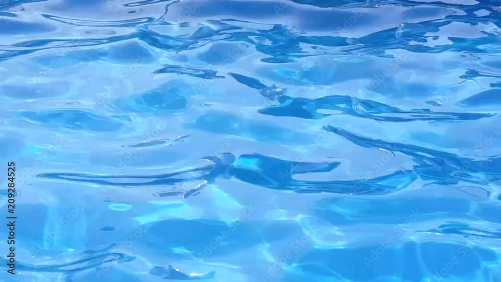 blue water in the pool with light ripples from the waves blue water in the pool with light ripples from the waves