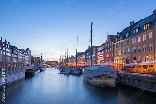 Nyhavn with the canal at night in Copenhagen city, Denmark