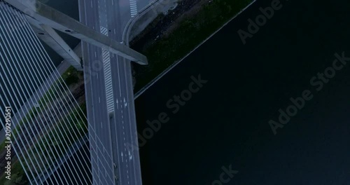 Aerial view of steel cable bridge crossing in Belgium. Road in perspective. European bridge over a river at sunset. photo