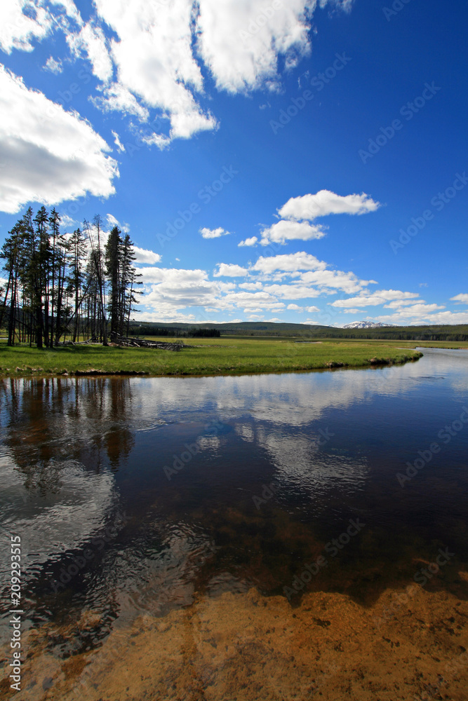 Gibbon River reflecting clouds in Gibbon Meadows in Yellowstone National Park in Wyoming United States