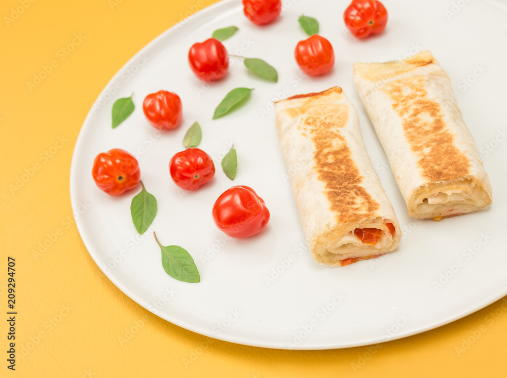 Cooked vegetarian tortillas on yellow background Cooked vegetarian tortillas on yellow background