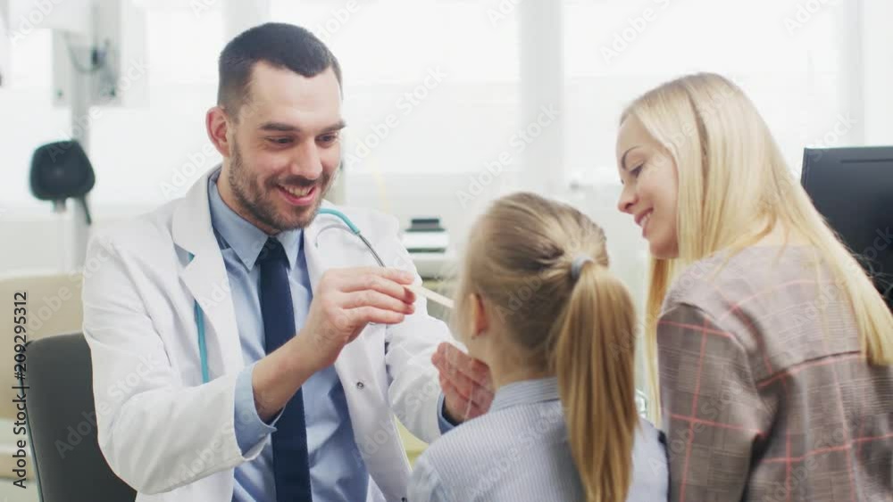 Friendly Doctor Checks up Little Girl's Sore Throat, Mother is Present for Support. Modern Medical Health Care, Friendly Pediatrician and Bright Office. Shot on RED EPIC-W 8K Helium Cinema Camera. Friendly Doctor Checks up Little Girl's Sore Throat, Mother is Present for Support. Modern Medical Health Care, Friendly Pediatrician and Bright Office. Shot on RED EPIC-W 8K Helium Cinema Camera.