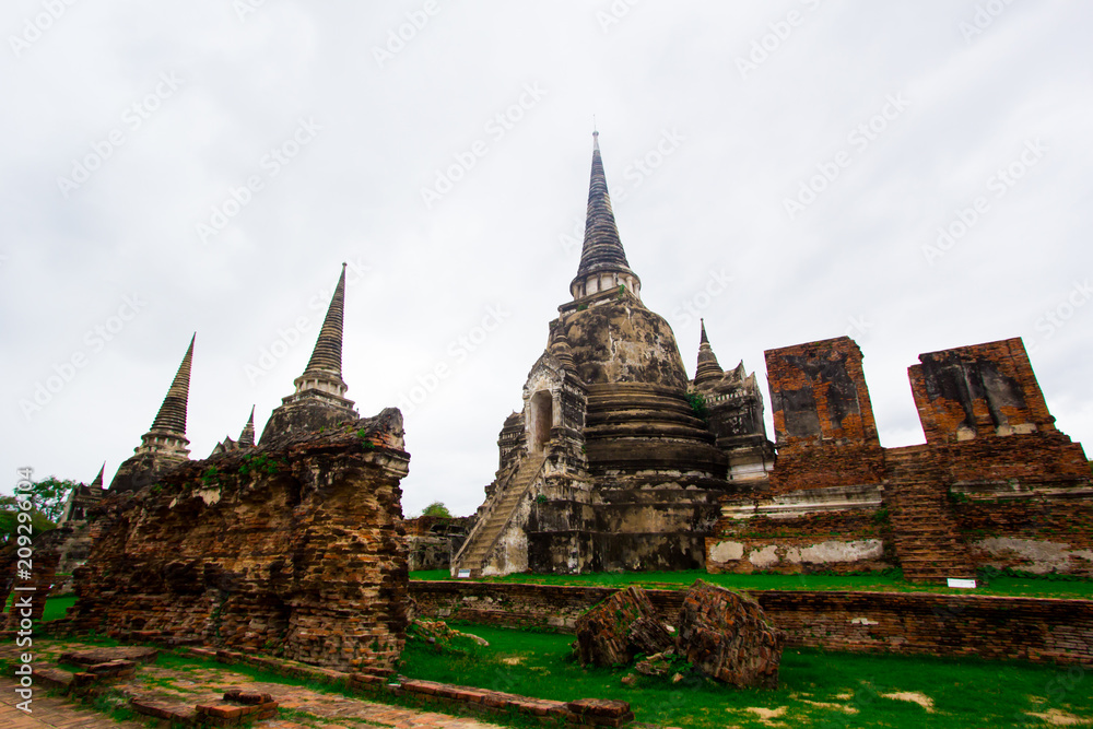 Fototapeta premium AYUTTHAYA, THAILAND - 10 June 2018 - The ruins of the old temple in Ayutthaya historical park, Ayutthaya, Thailand.