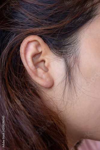close up young female ear and hair,   health concept