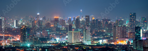 Abstract blurred city skyline at night background.