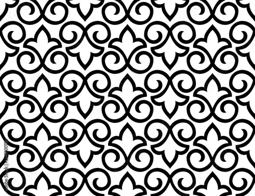 Wallpaper in the style of Baroque. A seamless vector background. White and black floral ornament. Graphic pattern for fabric, wallpaper, packaging. Ornate Damask flower ornament
