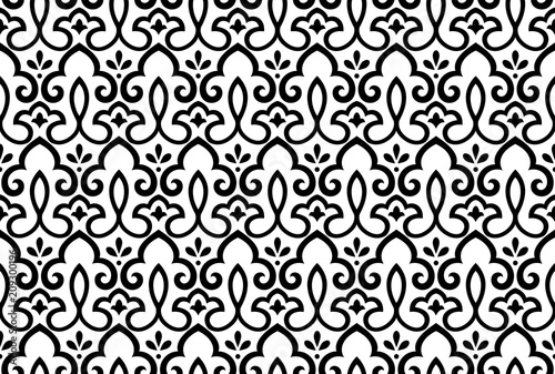 Wallpaper in the style of Baroque. A seamless vector background. White and black floral ornament. Graphic pattern for fabric, wallpaper, packaging. Ornate Damask flower ornament
