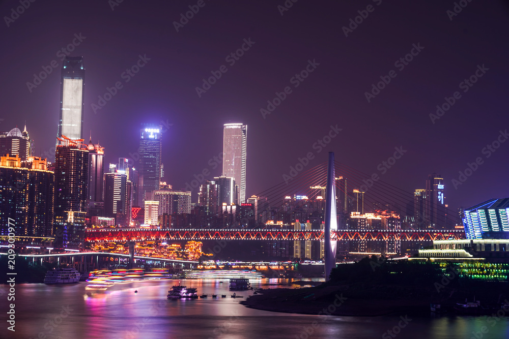 Obraz premium The night view of a prosperous city in chongqing, China