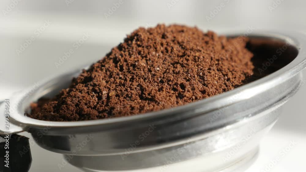 Espresso machine holder filled with ground coffee 4K footage Espresso machine holder filled with ground coffee 4K footage