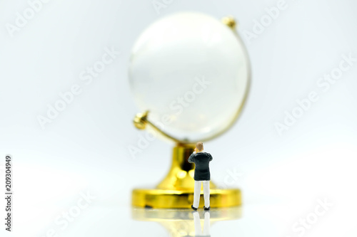 Miniature people : Businessman with glass globe.
