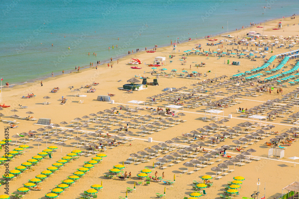 Aerial view of Rimini beach with people and blue water. Summer vacation concept.