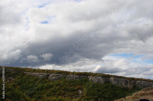 a panorama of cloudy autumn sky over the rocks of the Crimean mountains.