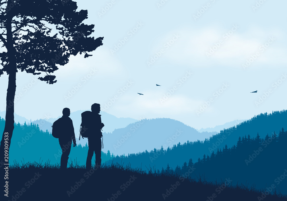 Two tourists with backpacks standing in mountain landscape with forest, under blue sky with clouds and flying birds Two tourists with backpacks standing in mountain landscape with forest, under blue sky with clouds and flying birds