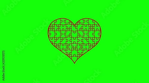 Animation of puzzle jigsaw heart. Disappearing pieces of the heart. Motion graphic video on green alpha channel