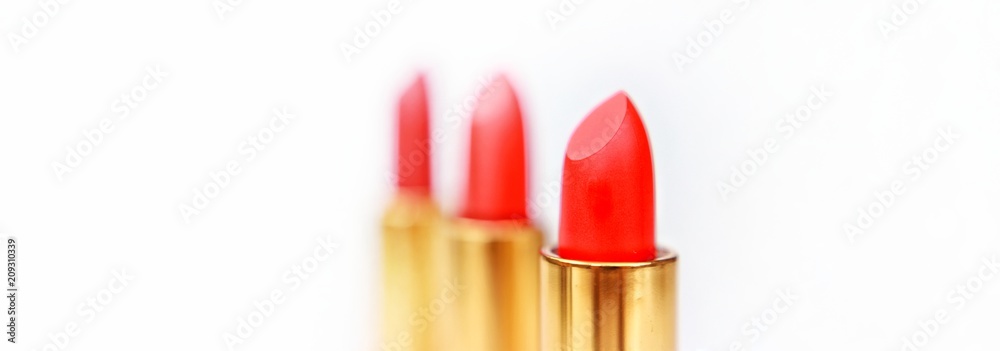 Obraz premium Set of colorful lipsticks for make up, top view, closeup, isolated, abstract, texture, on the white background
