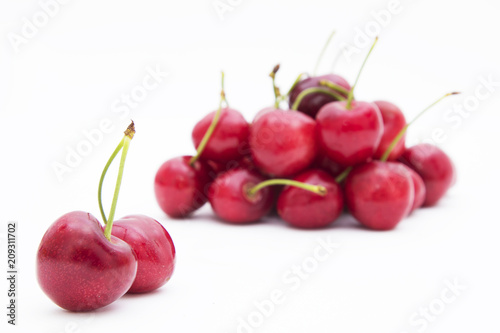 isolated cherries in white background © carballo