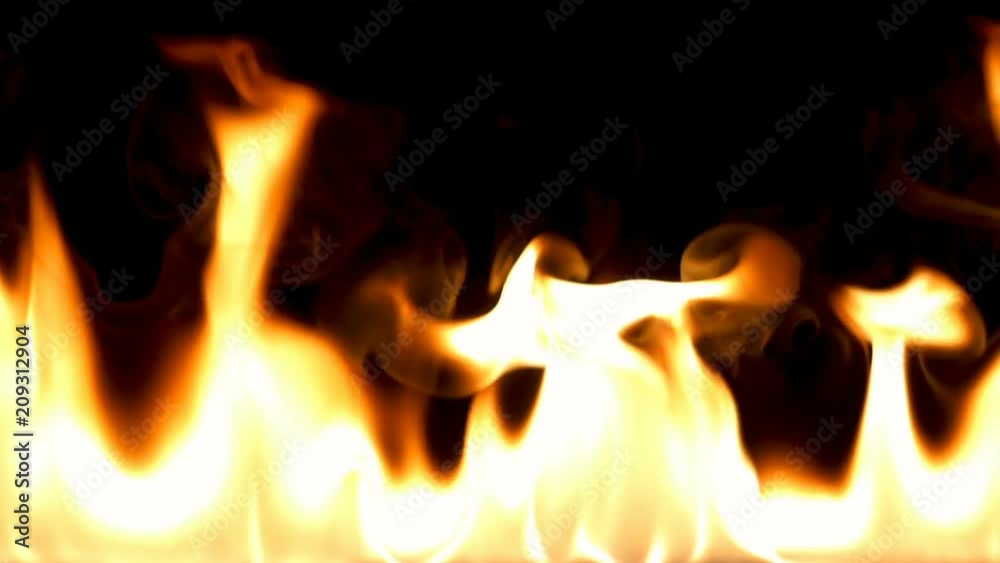 Realistic Fire Flames Igniting And Burning - Slow Motion. A line of real flames ignite on a black background. You can easily using Add or Screen transfer mode in your editing or compositing program. Realistic Fire Flames Igniting And Burning - Slow Motion. A line of real flames ignite on a black background. You can easily using Add or Screen transfer mode in your editing or compositing program.