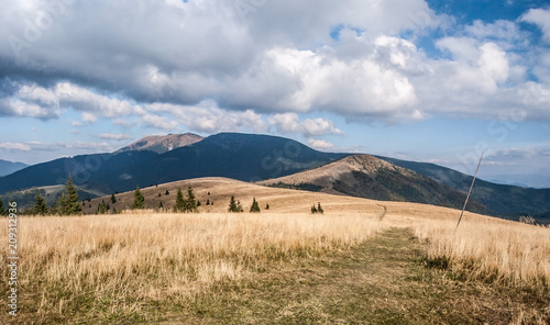 Kozi chrbat in Starohorske vrchy and Prasiva and Velka Chochula in NIzke Tatry from Kecka in Starohorske vrchy mountains in Slovakia during nice autumn day photo