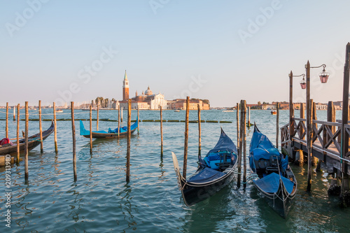 Amazing view on the beautiful Venice, Italy. Many gondolas sailing down one of the canals. © johnkruger1