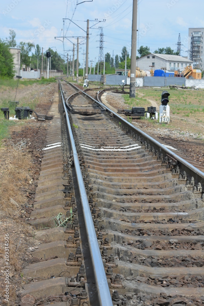 Full photo of the railway, railway track with branching and white marking in front of it