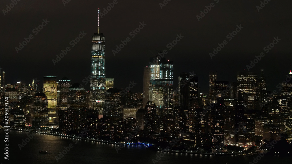 AERIAL: Skyline of World Trade and Financial Center complex lighted at night