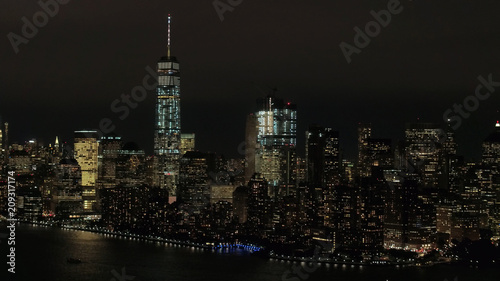 AERIAL: Skyline of World Trade and Financial Center complex lighted at night