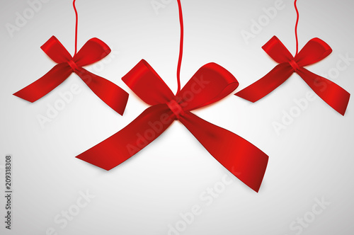 Shiny red satin ribbon on white background