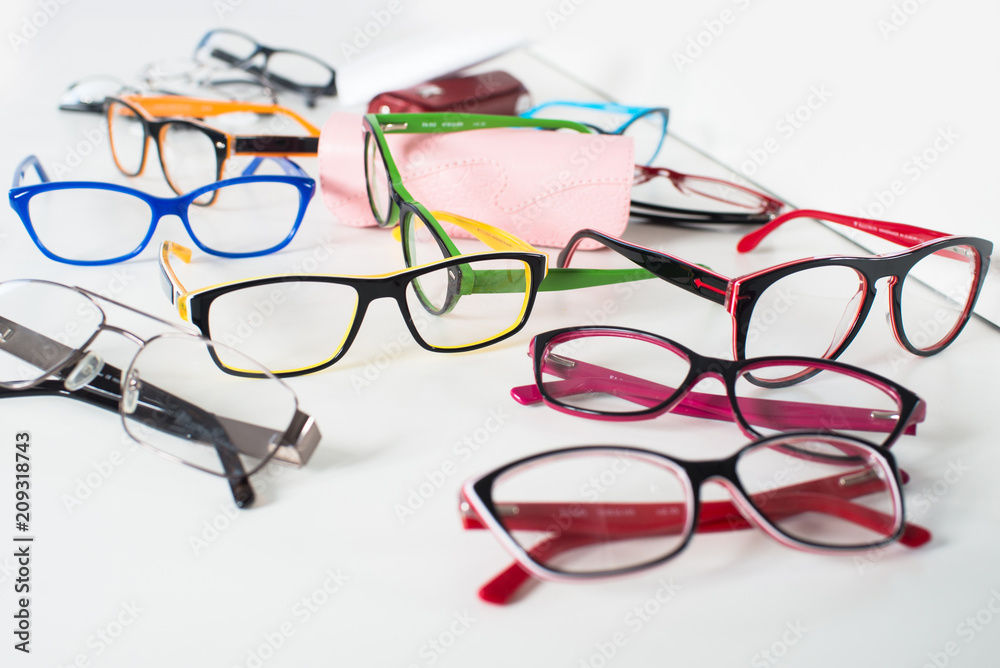 Set of many different colored glasses on white background Set of many different colored glasses on white background