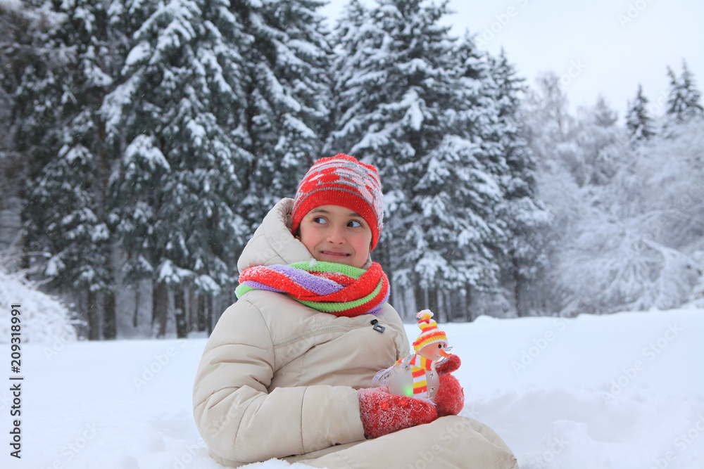 The frame depicts a winter forest, trees and pine trees. A child is playing with snow. Walk in the winter forest on vacation. The frame depicts a winter forest, trees and pine trees. A child is playing with snow. Walk in the winter forest on vacation.