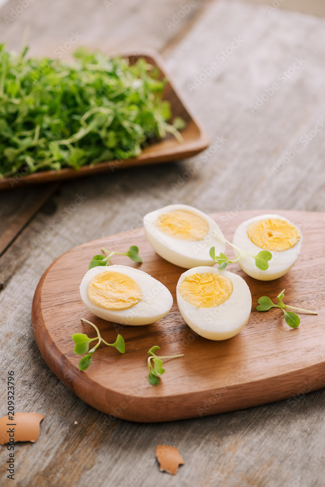 Slicing the hard-boiled eggs in two Slicing the hard-boiled eggs in two