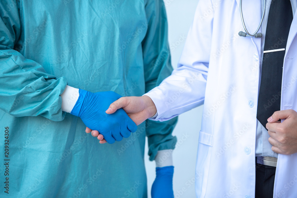 Doctors Shaking Hands together in the hospital. Doctors Shaking Hands together in the hospital.