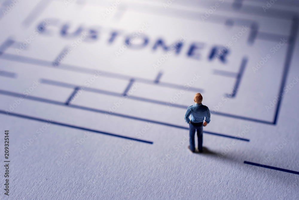 Challenge for Customer Experience Concept. present by Miniature Figure of Businessman standing on the Maze, looking for a Client Satisfaction Challenge for Customer Experience Concept. present by Miniature Figure of Businessman standing on the Maze, looking for a Client Satisfaction