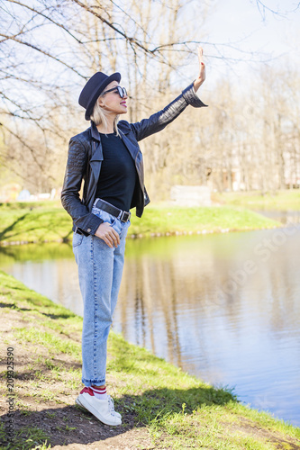 Cute Young Woman in Denim, Black Jacket and Hat Outdoors, Fashion Portrait