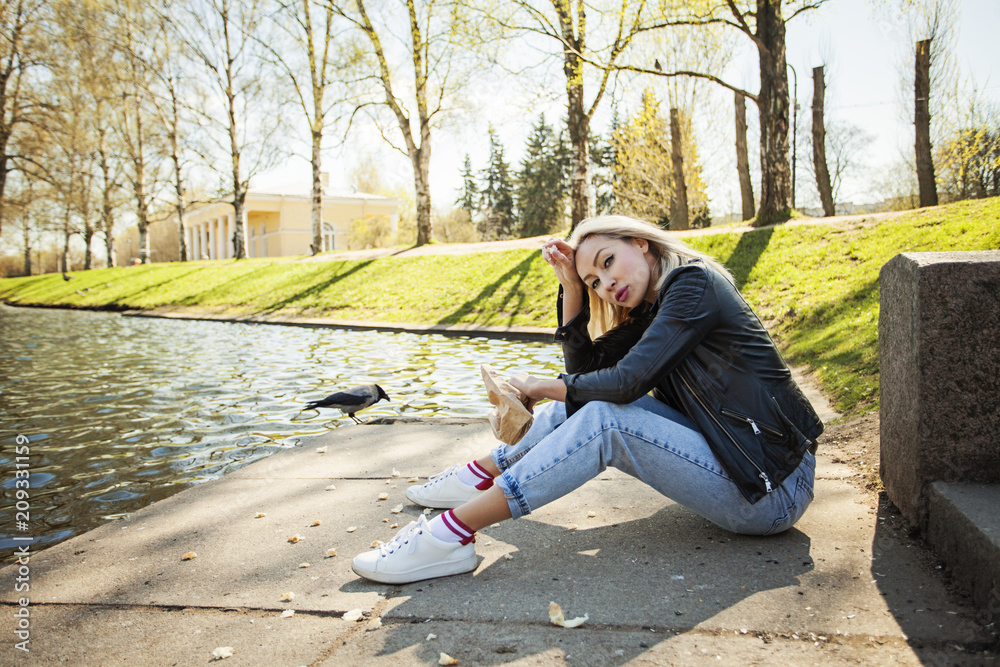 Fototapeta premium Tired woman relaxing outdoors in park