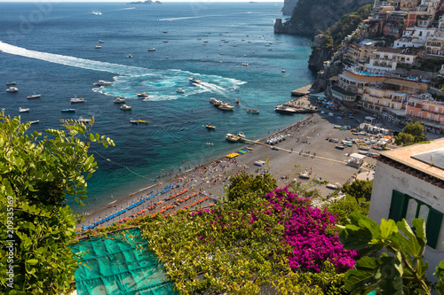  The main beach in Positano, Spiaggia Grande, with its bright orange and blue beach umbrellas and the sparkling blue sea of the Amalfi Coast. photo