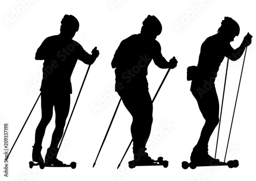 Young athlete with roller skis on a white background photo